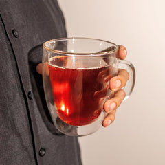 20 Leaves brewed cup showing deep amber tea and indicating rich flavor