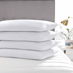 Acteb pillow in styled bed illustrating low loft comfort and neat bedroom appearance