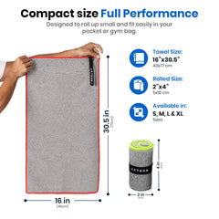 Acteon towel snapped and hanging on backpack strap for hands-free drying and access