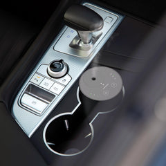Airversa ADX placed in car cup holder showing secure fit and consistent in-vehicle fragrance