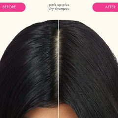 Spraying Amika Perk Up Plus onto roots to refresh hair and lift oil