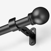 AMZSEVEN black curtain rod front view showing clean finish and finial benefit