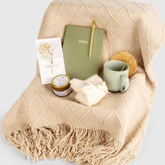 Anforsun accessories arrangement displaying candle, notebook, pen and socks