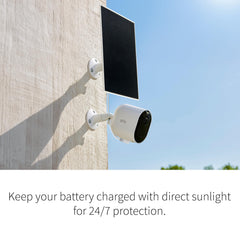 Arlo solar panel mounted beside an Arlo camera demonstrating seamless, wired power benefit