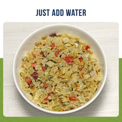 Augason Farms pouring rehydrated vegetables into a bowl for quick meal boost