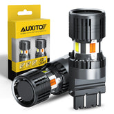 AUXITO front view of 3157 switchback LED bulbs showing packaging and benefits