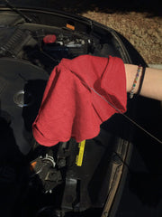 Avalon Towels towel held in hand showing convenient 12x14 size