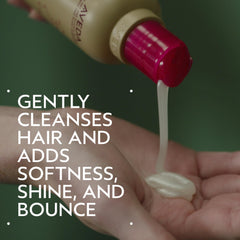 Aveda shampoo texture poured into hand, highlights gentle cleansing action