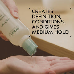 Aveda Confixor pump and cap detail highlighting easy dispensing benefit