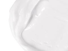 Babo Botanicals lotion swatch on arm showing quick absorption and non-greasy feel