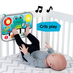 Baby Einstein pad attached to crib demonstrating hands-free kick activation benefit