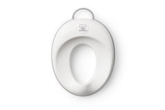 BabyBjörn toilet trainer front view showing white and gray ergonomic seat for comfort