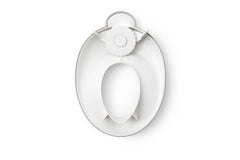 BabyBjörn toilet trainer placed on adult toilet in bathroom setting for easy fit demonstration