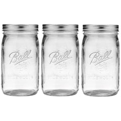 Ball front view of three 32 oz wide-mouth jars showing clear glass and labels for easy storage