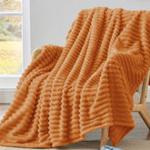BEDELITE front view of burnt orange throw showing color and drape for seasonal warmth