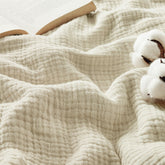 Bedsure muslin blanket front view shows linen beige warmth and cozy appeal