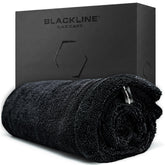 Blackline front view of towel showing full 24x36 size and coverage benefit