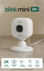 Blink Mini 2K+ on an included stand angled on a table for flexible indoor placement