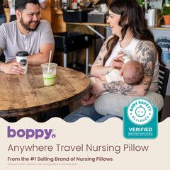 Boppy Anywhere snapped closed attached to a bag for easy transport and storage