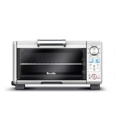 Breville mini smart oven front view showing compact size and stainless steel benefits