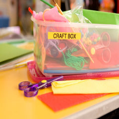 Brother PT-M95 printed labels in use organizing files and jars neatly