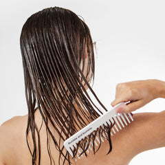 Bumble and bumble applied to wet hair in shower for detangling benefit