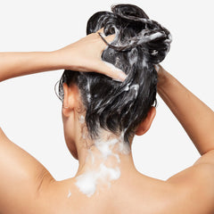 Bumble and bumble shampoo pouring texture to demonstrate spreadability and foam benefit