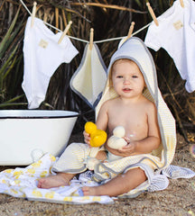 Burt's Bees Baby towel wrapped around infant after bath illustrating warm absorbency benefit