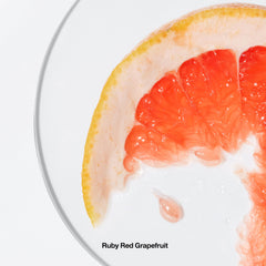 Clinique Happy Body Spritz with grapefruit and mimosa ingredients illustrating bright notes