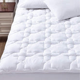 CozyLux queen mattress pad front view showing neat fitted skirt and smooth cotton top for comfort