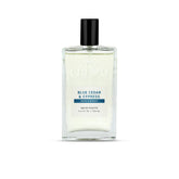 Cremo front bottle showing Blue Cedar & Cypress label and premium design benefit
