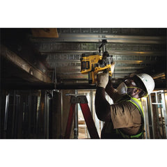 DEWALT DCH273B in use drilling concrete demonstrating efficient masonry performance
