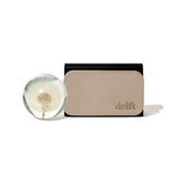 drift front packaging showing stone block and sealed pouch for preserved scent