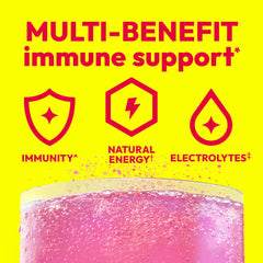 Single Emergen-C Raspberry packet held between fingers, brand and quick dosing visible