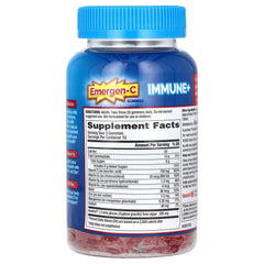Open Emergen-C bottle pouring gummies, convenient on-the-go immune support