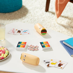 Exploding Kittens components overhead view showing cards, burritos for easy setup
