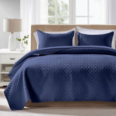 FLYMME navy quilt front view showing neat drape and cozy appeal