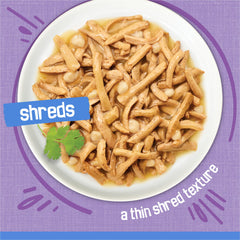 Friskies cheese accents visible in shreds enhancing savory flavor benefit