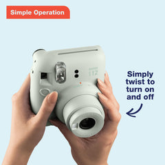 Fujifilm Instax Mini 12 open lens close-up highlighting easy twist power and mode