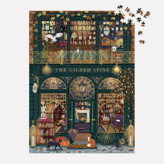 Galison puzzle in progress on dining table showing social assembly and ongoing build benefit