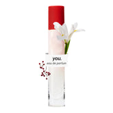 Glossier You travel bottle front view showing compact design and brand