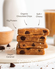 GoMacro single unwrapped bar beside a hand for scale showing portable, on-the-go convenience