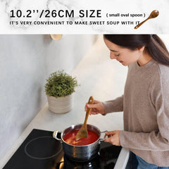 Hefild utensils stirring a saucepan demonstrating heat-safe use and gentle cookware care