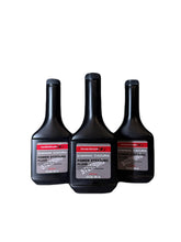 Honda power steering fluid front pack showing three bottles and OEM label for reliability