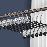 HWAJAN front view of 20-pack black hangers showing tidy storage benefit