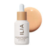 ILIA front bottle showing Bom Bom ST5 shade and portable pump benefits
