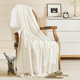 inhand front view of off white knitted throw shows cozy couch styling benefit