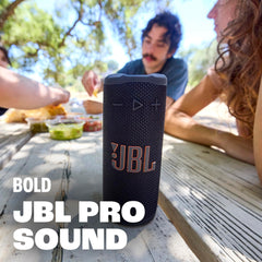 JBL Grip held in one hand to show compact size and portability benefit