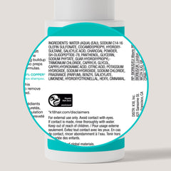 K18 bottle held in hand to show 8.5 fl oz scale and travel-friendly size
