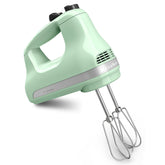 KitchenAid front view of white hand mixer showing controls and compact design benefits